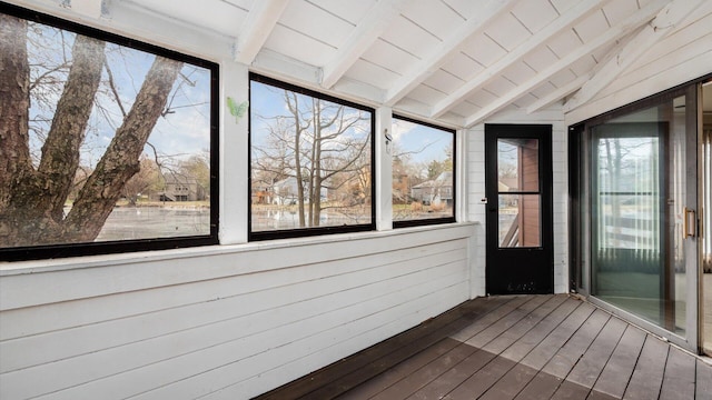 unfurnished sunroom with lofted ceiling with beams and wood ceiling