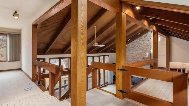 interior space featuring vaulted ceiling with beams and wood ceiling