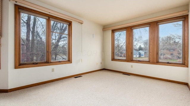 unfurnished room featuring carpet flooring