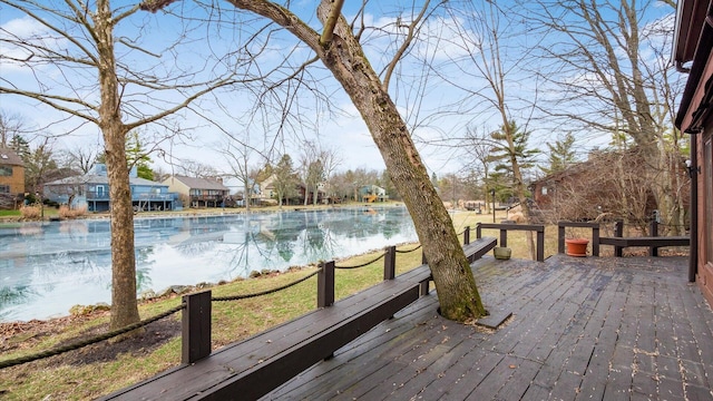 wooden deck featuring a water view