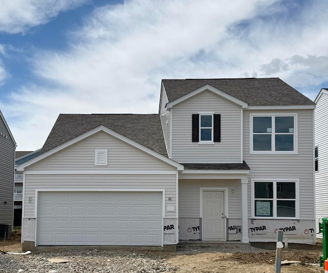 153 Reneau Ave Lot 38, Galloway, OH 43119 - traditional home with roof with shingles, driveway, and an attached garage