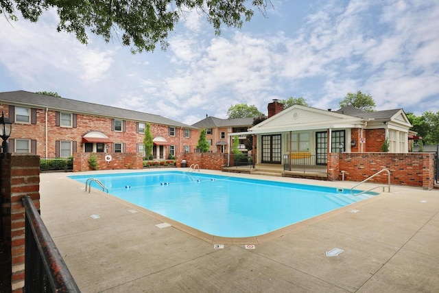 view of pool featuring a patio