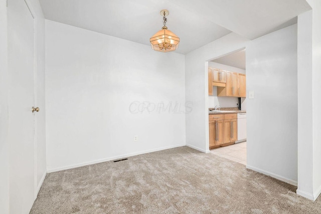 empty room with light colored carpet