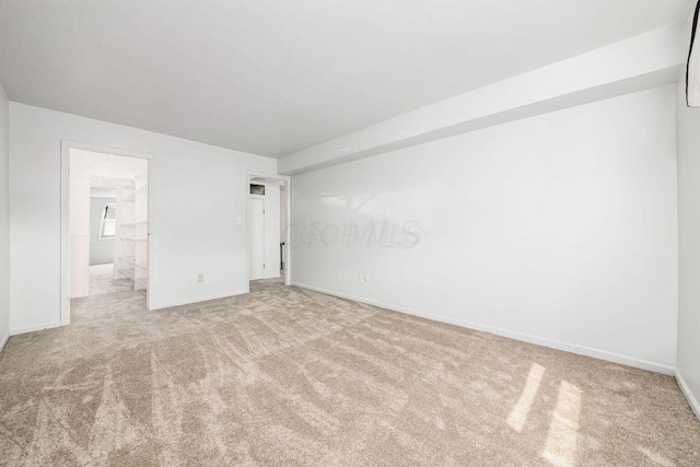 unfurnished bedroom featuring light carpet