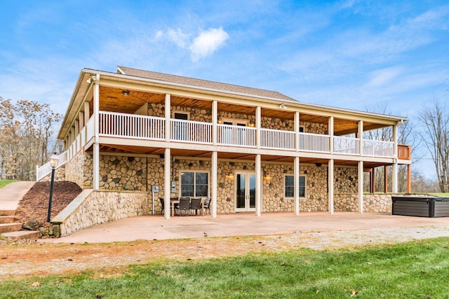 rear view of property featuring a patio