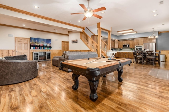 playroom featuring crown molding, wood walls, light wood-type flooring, and billiards