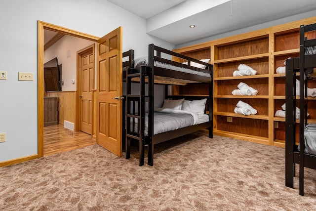 bedroom featuring light carpet