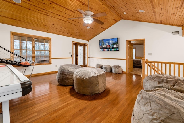 living room with lofted ceiling, hardwood / wood-style floors, and wood ceiling