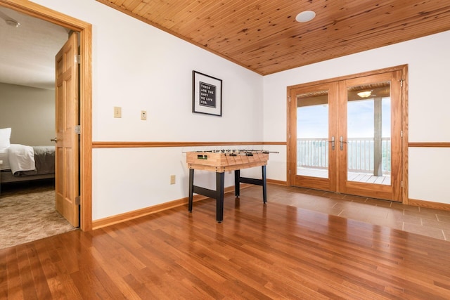 misc room featuring wood ceiling, french doors, and hardwood / wood-style flooring