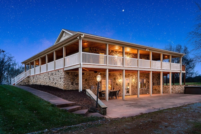 rear view of house featuring a patio