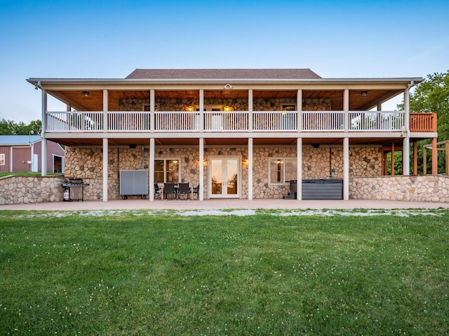 back of house featuring a yard and a patio