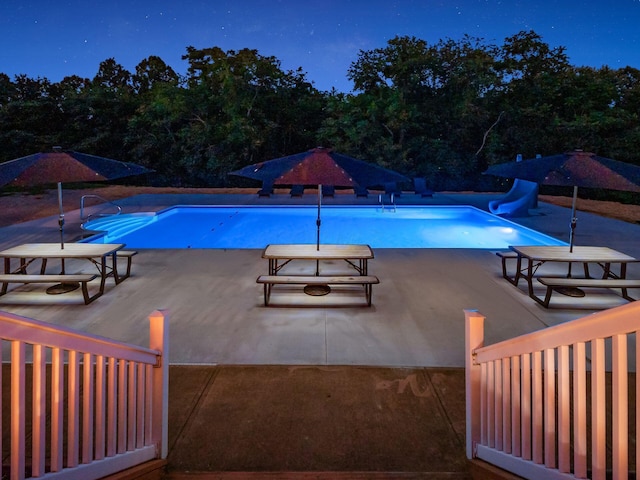 view of swimming pool featuring a patio and a water slide