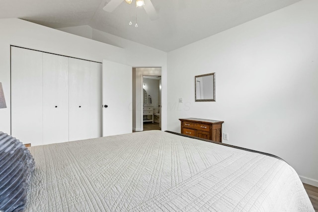 bedroom featuring vaulted ceiling, wood-type flooring, ceiling fan, and a closet