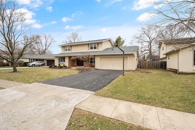 front of property with a garage and a front lawn