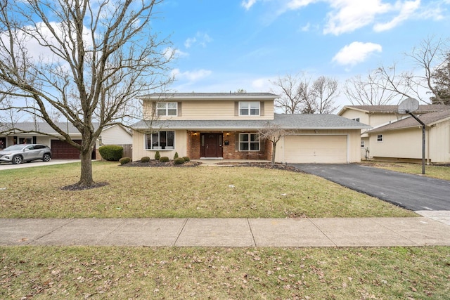 view of front property with a garage and a front yard