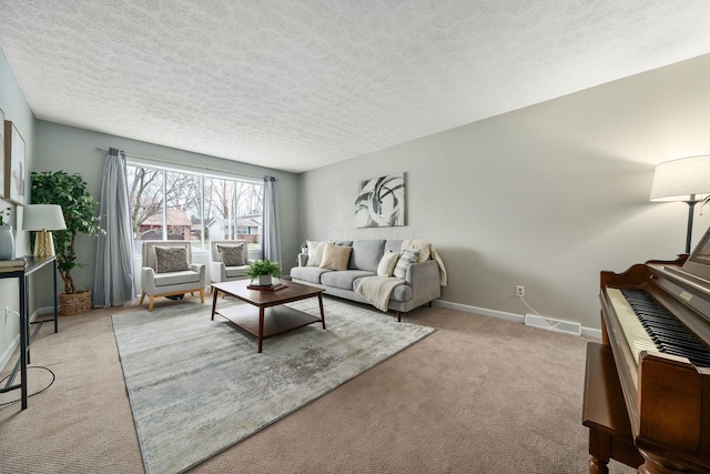 living room featuring light colored carpet and a textured ceiling