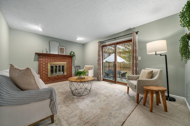 living room featuring light carpet, a brick fireplace, and a textured ceiling