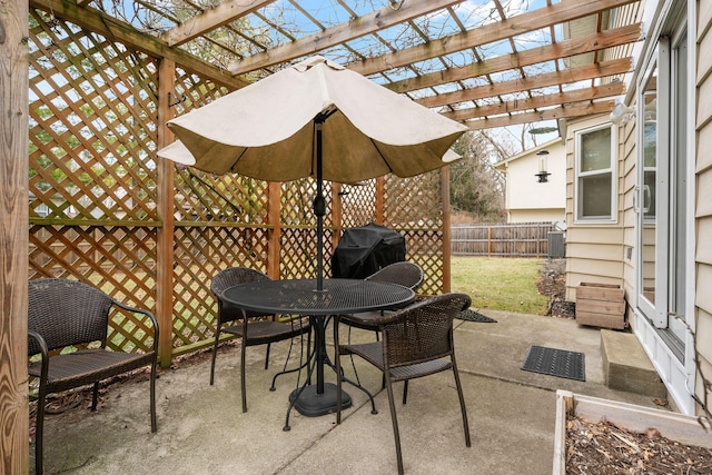 view of patio featuring grilling area and a pergola