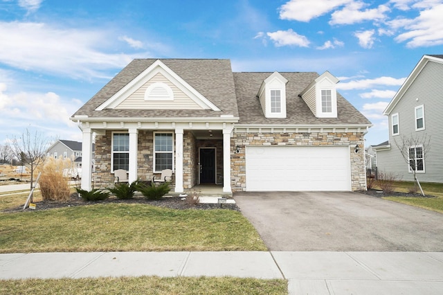 view of front facade featuring a garage and a front yard