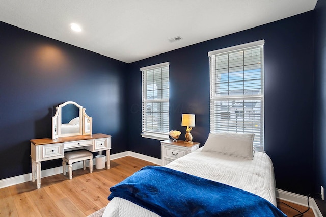 bedroom with hardwood / wood-style floors