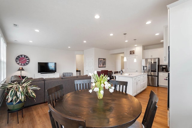 dining room featuring light hardwood / wood-style floors