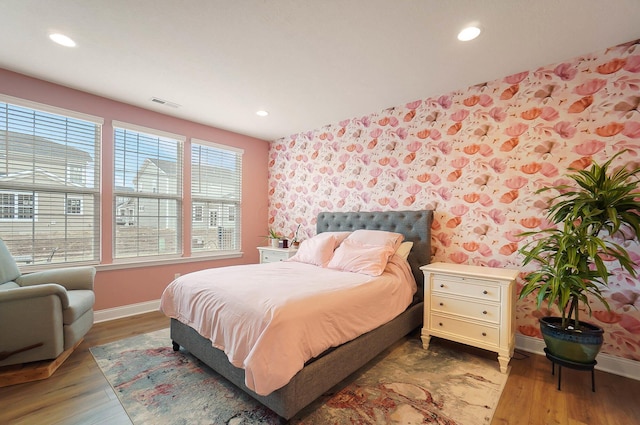 bedroom with wood-type flooring