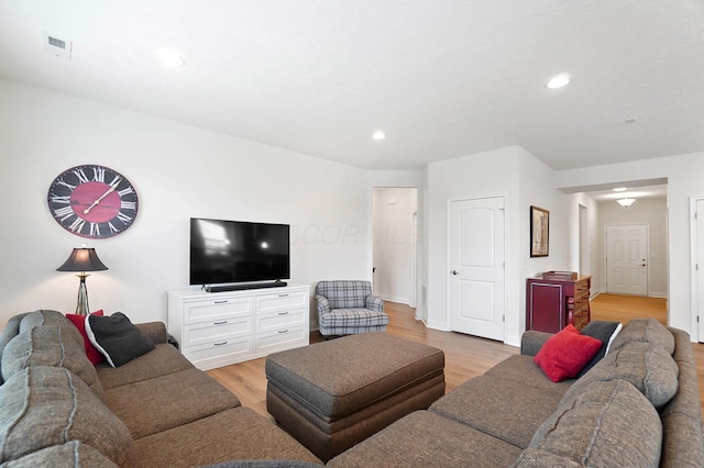 living room with light hardwood / wood-style floors