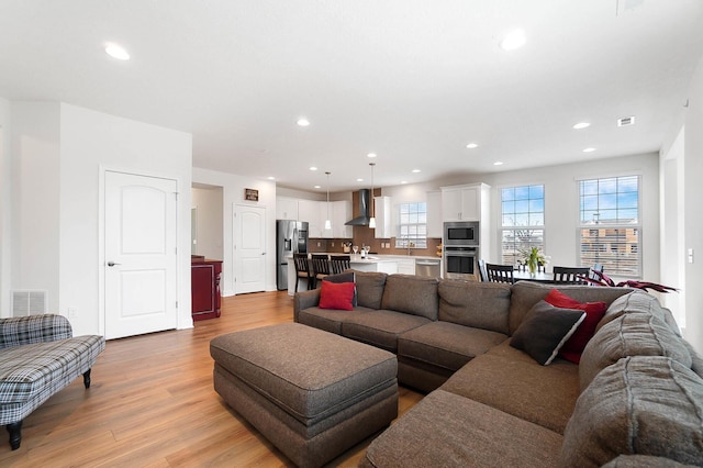 living room with light hardwood / wood-style floors