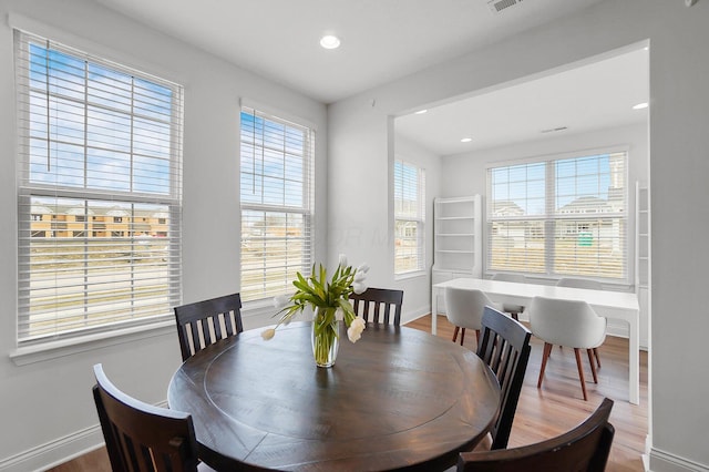 dining space featuring hardwood / wood-style floors