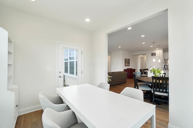 dining space featuring dark hardwood / wood-style flooring