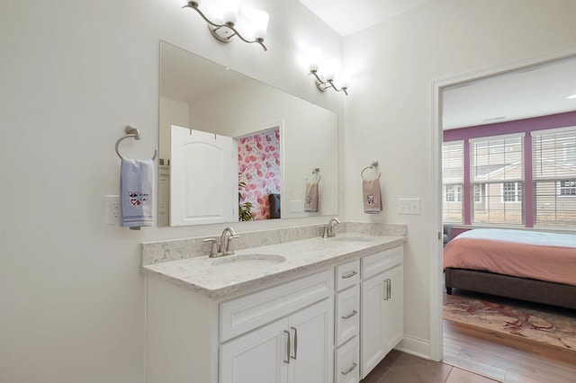 bathroom featuring tile patterned flooring and vanity