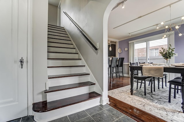 staircase featuring tile patterned flooring and rail lighting