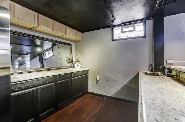 bathroom with hardwood / wood-style flooring and sink