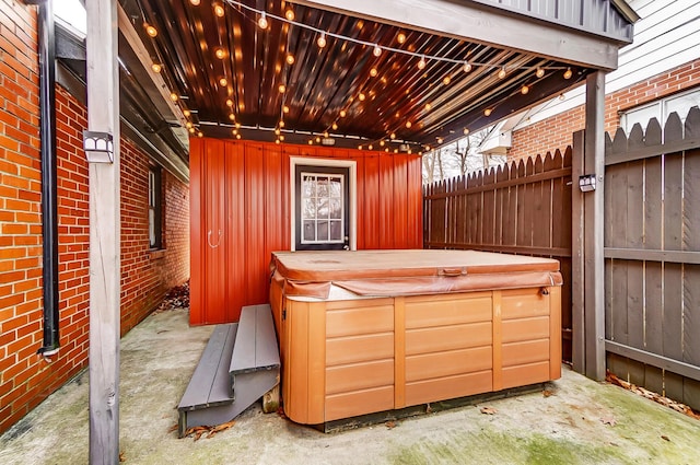 view of patio / terrace featuring a hot tub