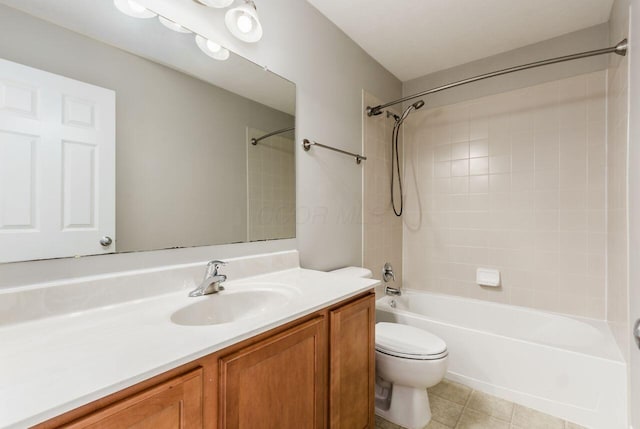 bathroom featuring toilet, tile patterned flooring, vanity, and shower / bathing tub combination