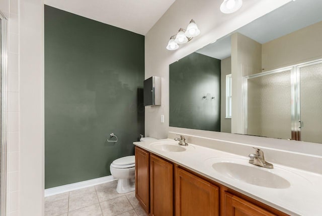 bathroom with toilet, tile patterned flooring, a sink, and a shower stall