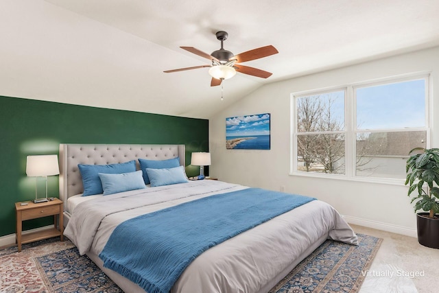 bedroom featuring lofted ceiling, ceiling fan, carpet flooring, and baseboards