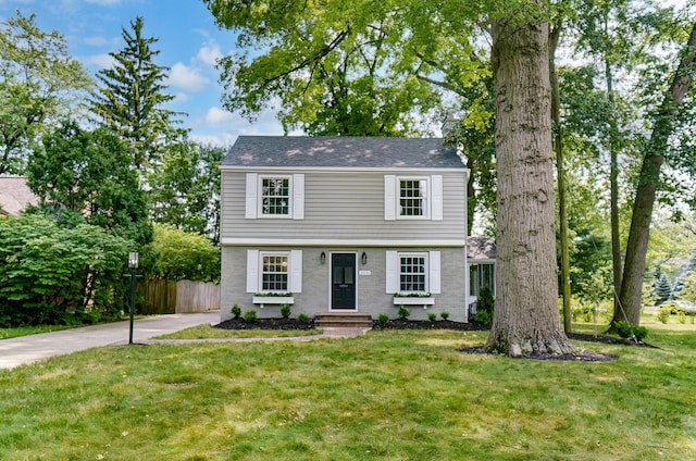 front facade with a front yard