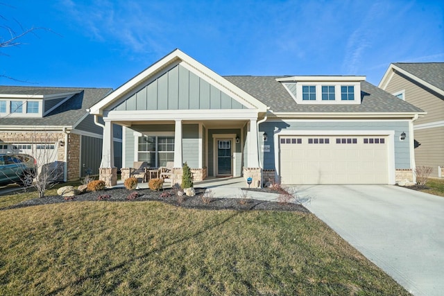 craftsman-style house featuring a front yard and a porch