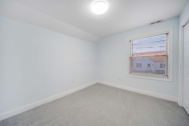 4874 Ridge St, Columbus, OH 43207 - carpeted empty room with vaulted ceiling