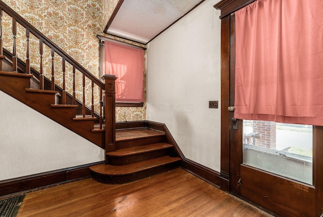 stairway featuring wood-type flooring