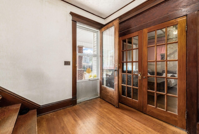 doorway featuring hardwood / wood-style flooring and french doors