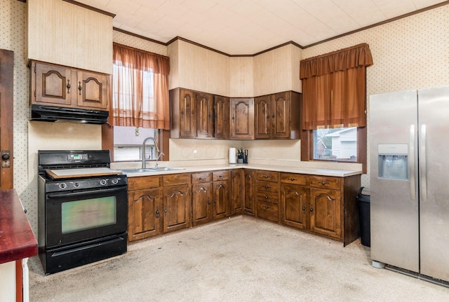 kitchen featuring sink, crown molding, stainless steel refrigerator with ice dispenser, gas stove, and light carpet