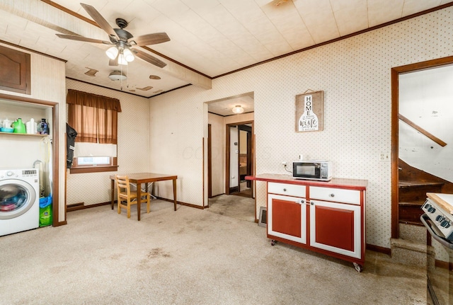 kitchen with light carpet, washer / clothes dryer, crown molding, and ceiling fan