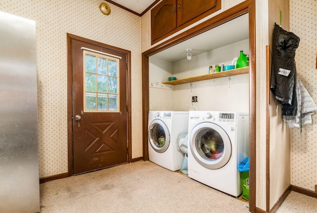 clothes washing area featuring independent washer and dryer