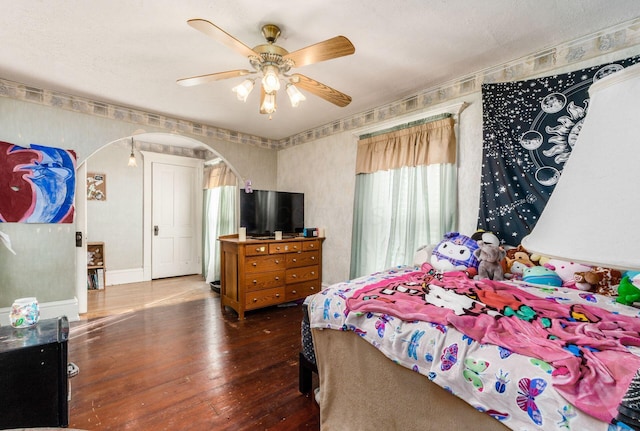 bedroom featuring wood-type flooring and ceiling fan