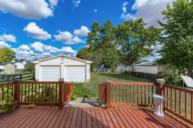 wooden terrace with a garage, a shed, and a lawn