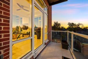 view of balcony at dusk