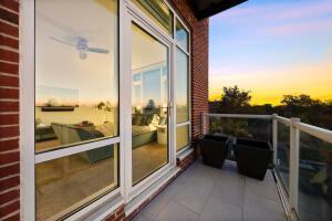 view of balcony at dusk