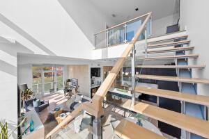 staircase featuring a high ceiling